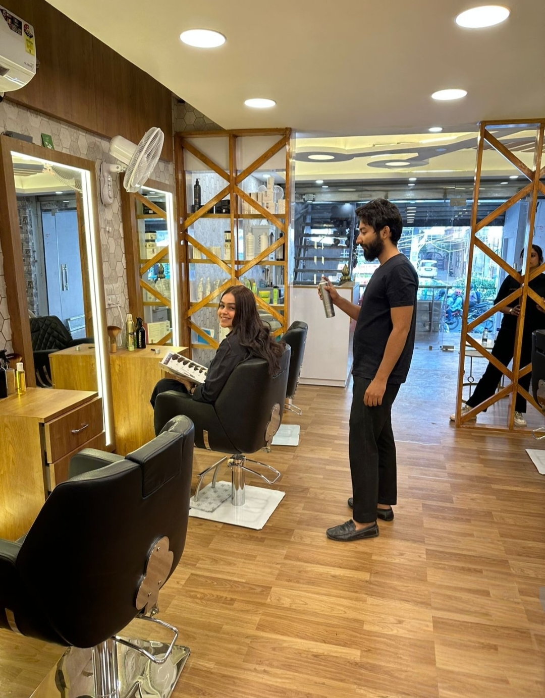 Classic Curl Salon interior — stylist working on client's hair